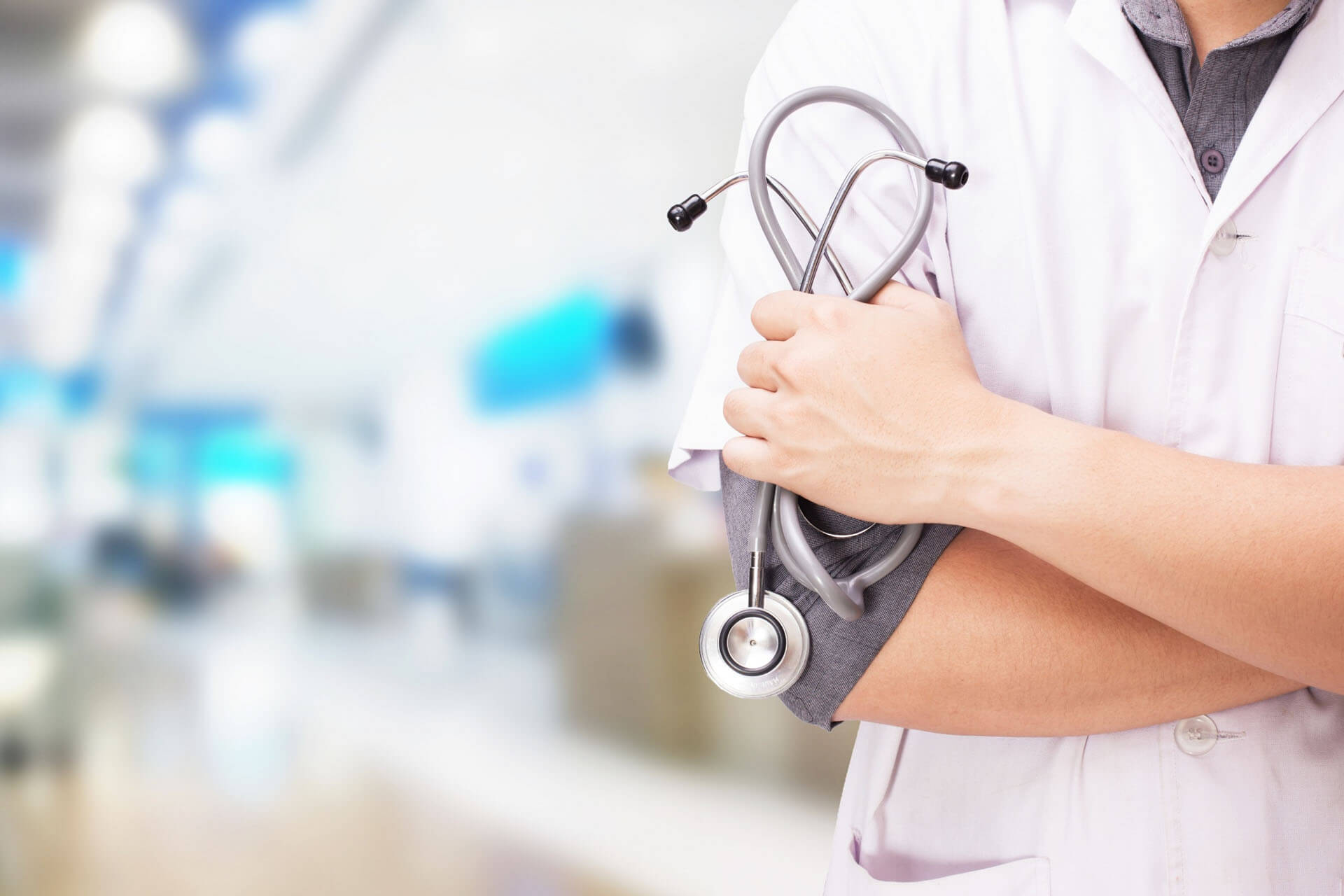 doctor-with-stethoscope-hands-hospital-background (1)